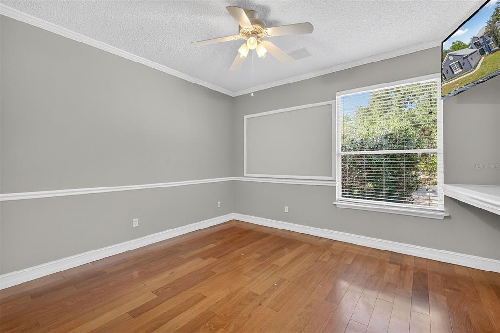 28004 Shirley Shores Road Tavares, FL 32778 - Photo 26 of 68 an empty room with a window and a fan