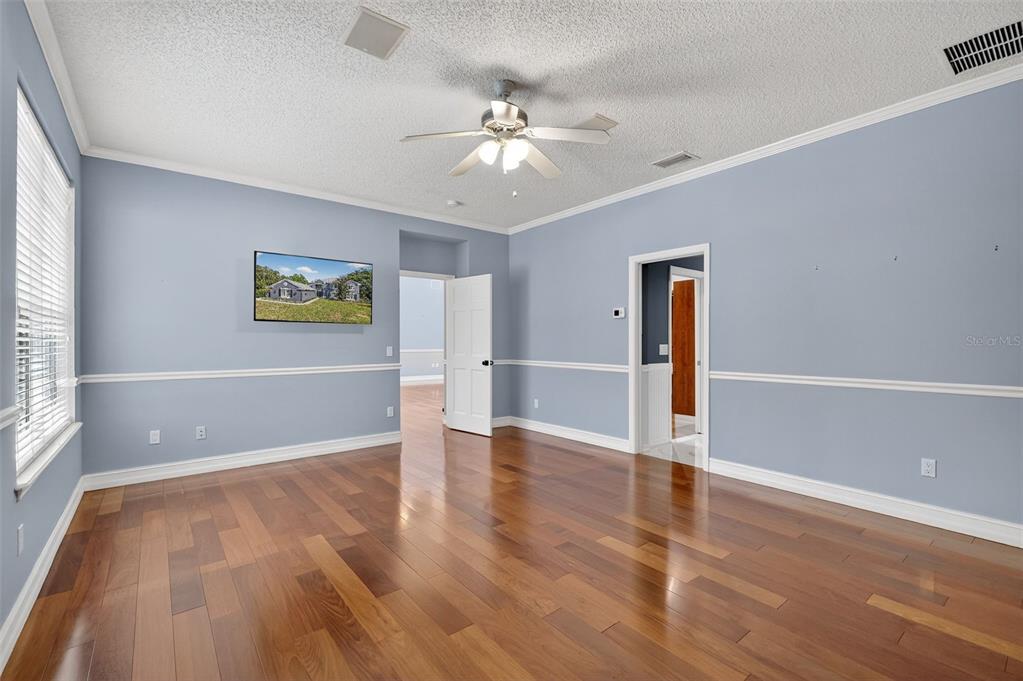 28004 Shirley Shores Road Tavares, FL 32778 - Photo 30 of 68 wooden floor in an empty room with a window