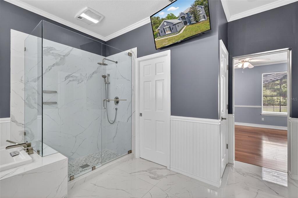 28004 Shirley Shores Road Tavares, FL 32778 - Photo 35 of 68 a bathroom with a shower and a sink