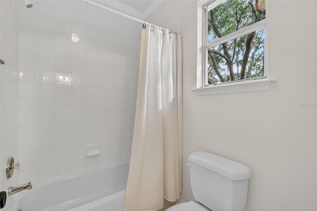 28004 Shirley Shores Road Tavares, FL 32778 - Photo 43 of 68 a bathroom with a toilet and a shower
