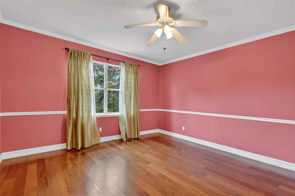 28004 Shirley Shores Road Tavares, FL 32778 - Photo 44 of 68 an empty room with wooden floor and windows