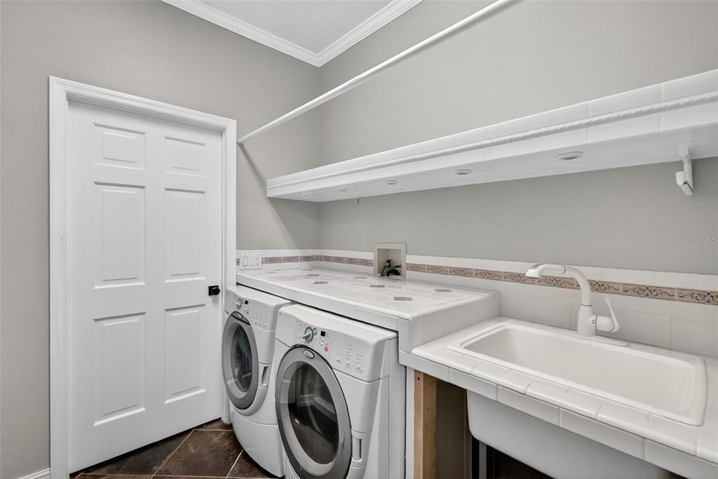 28004 Shirley Shores Road Tavares, FL 32778 - Photo 45 of 68 a utility room with dryer and washer