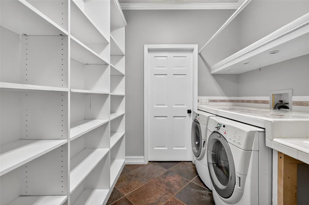 28004 Shirley Shores Road Tavares, FL 32778 - Photo 46 of 68 a utility room with dryer and washer