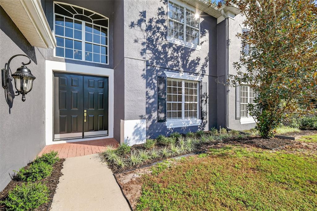 28004 Shirley Shores Road Tavares, FL 32778 - Photo 5 of 68 a front view of a house with a yard