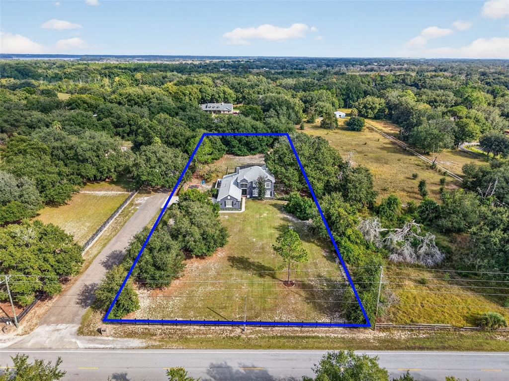 28004 Shirley Shores Road Tavares, FL 32778 - Photo 62 of 68 an aerial view of a residential houses with outdoor space and street view