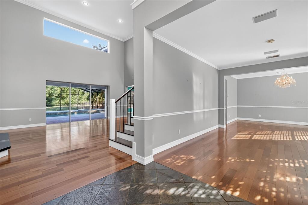 28004 Shirley Shores Road Tavares, FL 32778 - Photo 7 of 68 a view of entryway with a window and wooden floor
