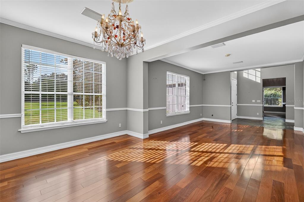 28004 Shirley Shores Road Tavares, FL 32778 - Photo 8 of 68 a view of an empty room with wooden floor and a window