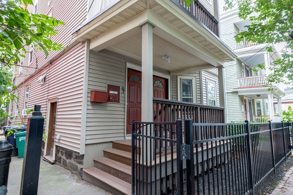 65 Allston Street, Unit 2 Cambridge, MA 02139 - Photo 11 of 11 a view of a house with iron fence