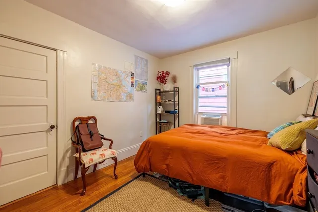 a bedroom with a bed and a closet