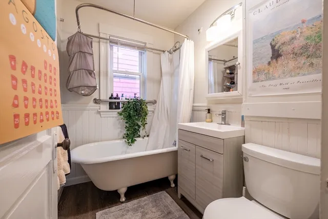 a bathroom with a toilet a sink and a bathtub