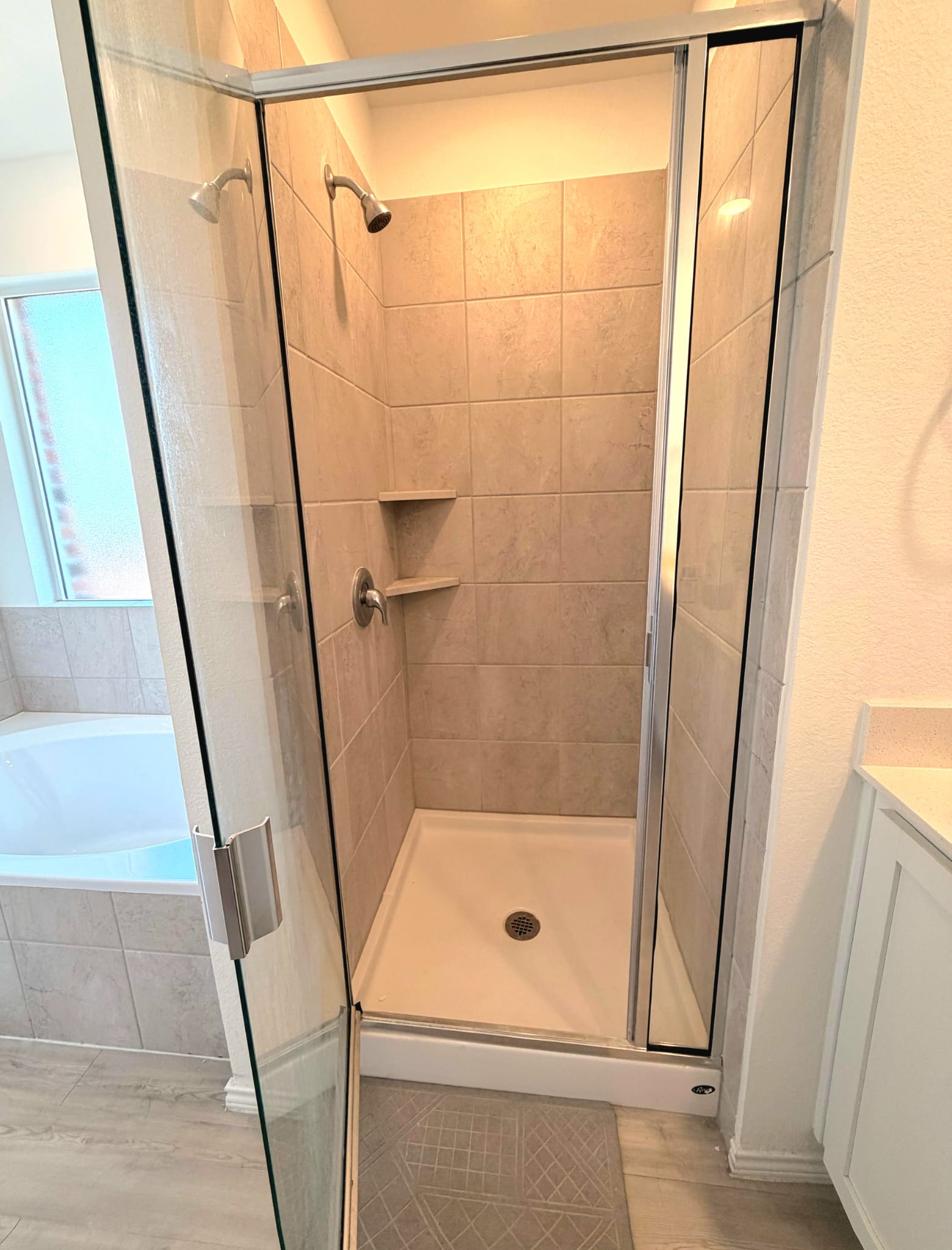 2520 Four Waters Loop Georgetown, TX 78628 - Photo 5 of 15 a bathroom with a shower and tub