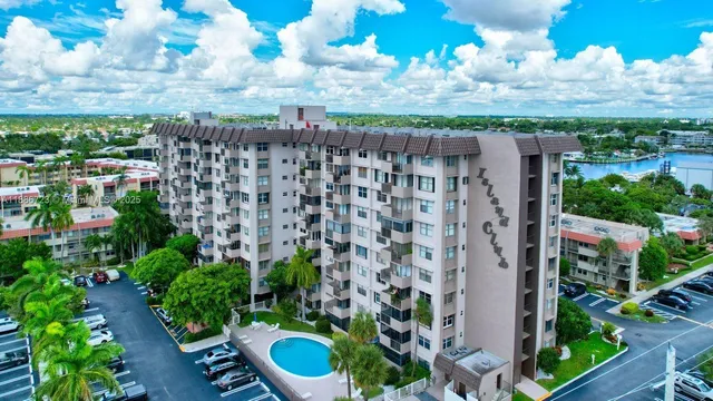 a balcony with lots of green space and plants