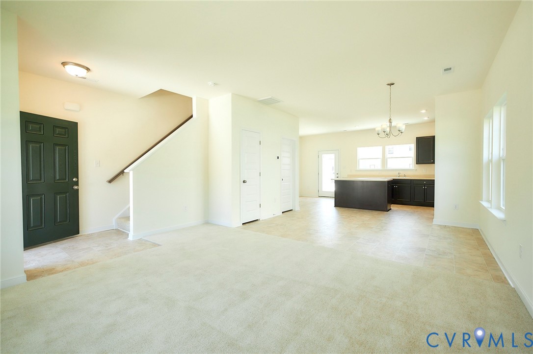 214 Greenpark Road Sandston, VA 23150 - Photo 10 of 50 Unfurnished living room featuring light carpet, a