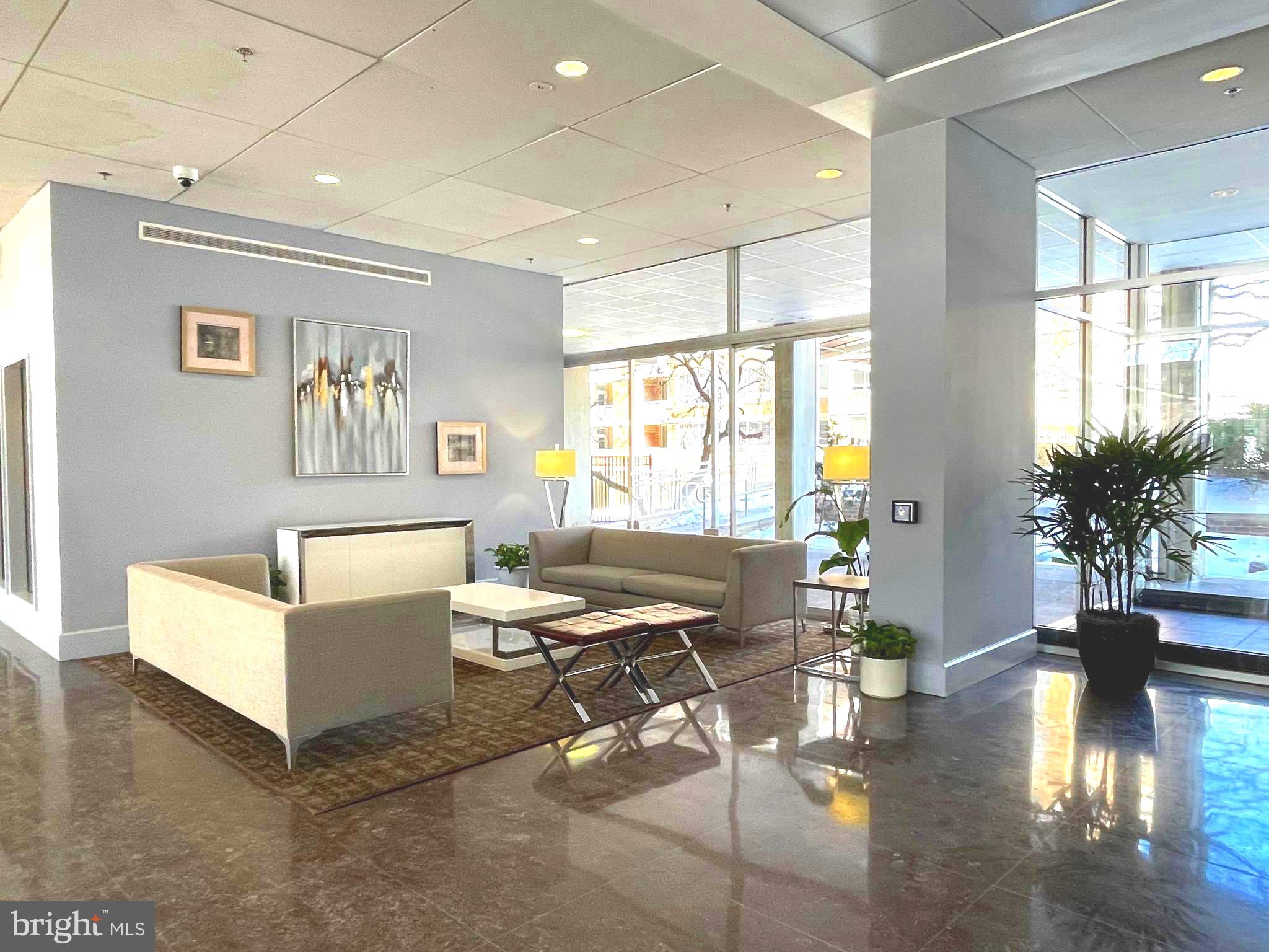 a living room with furniture and a large window