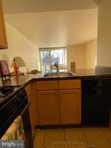 a bathroom with sink and mirror