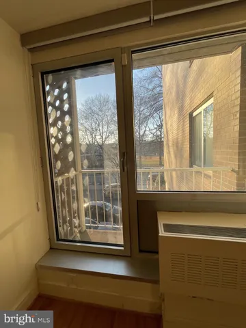 a view of a room that has a large window