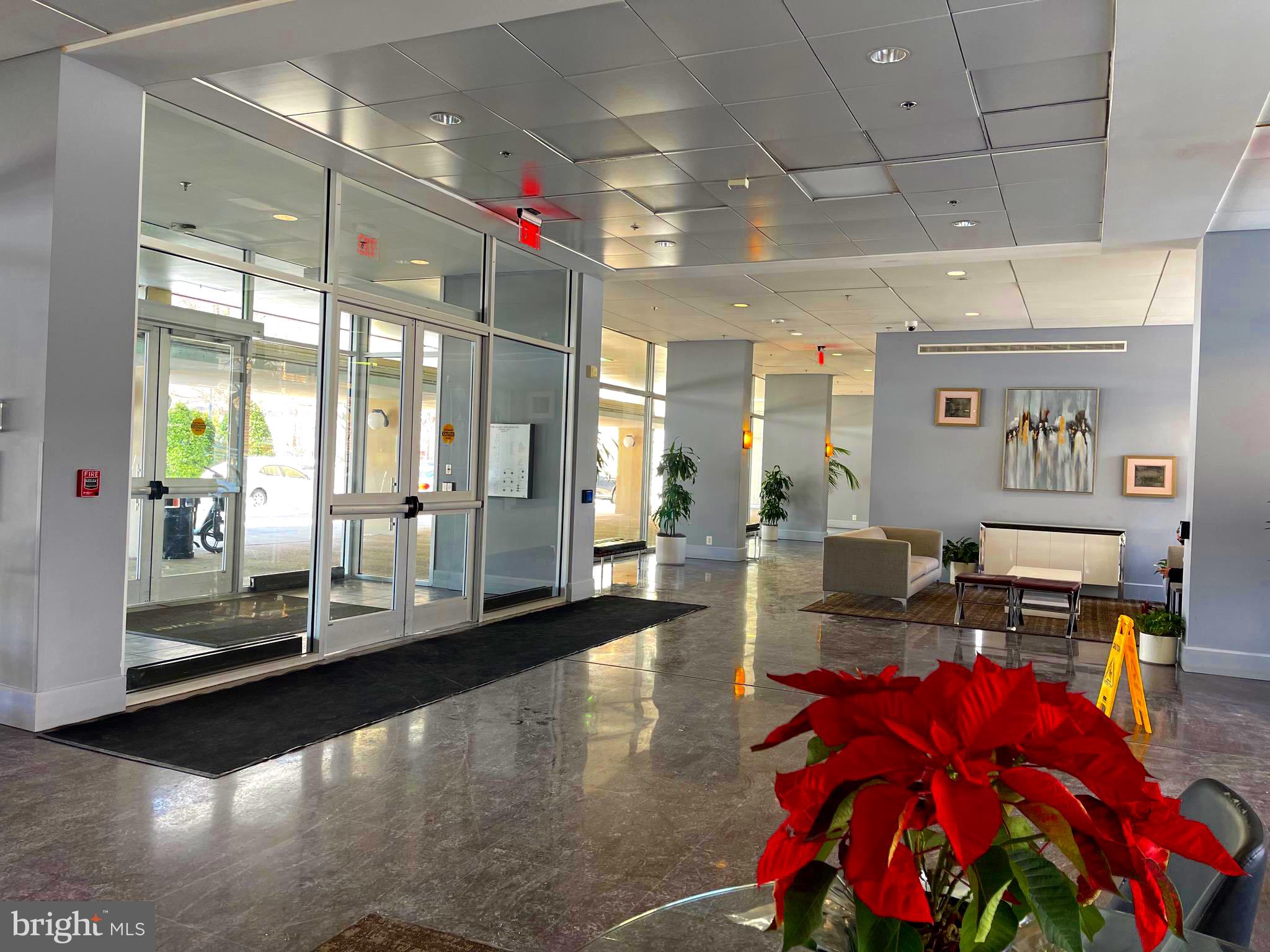 800 4th Street Southwest, Unit N103 Washington, DC 20024 - Photo 2 of 56 a living room with lots of furniture and a chandelier