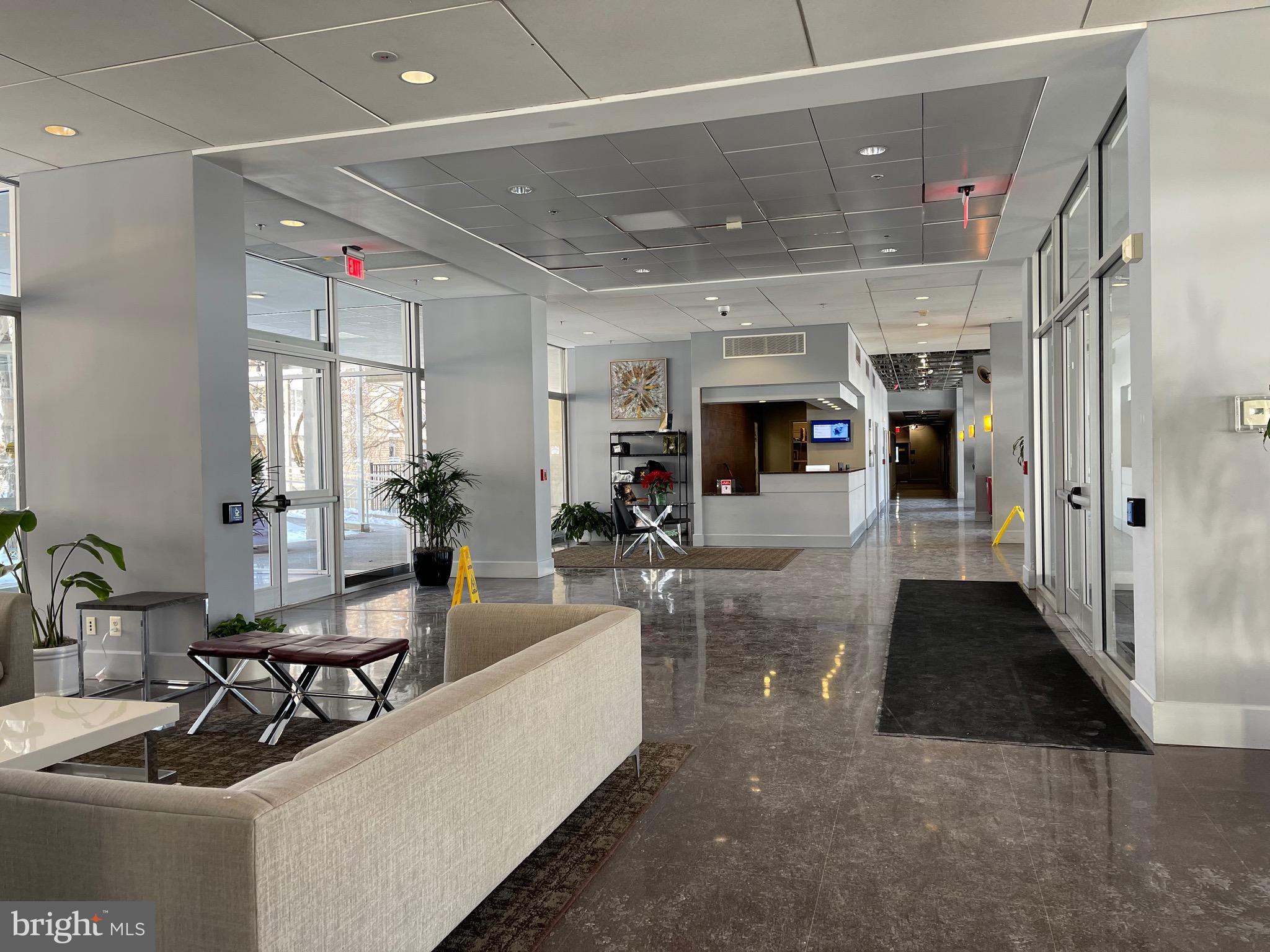800 4th Street Southwest, Unit N103 Washington, DC 20024 - Photo 3 of 56 a living room with furniture and a large window