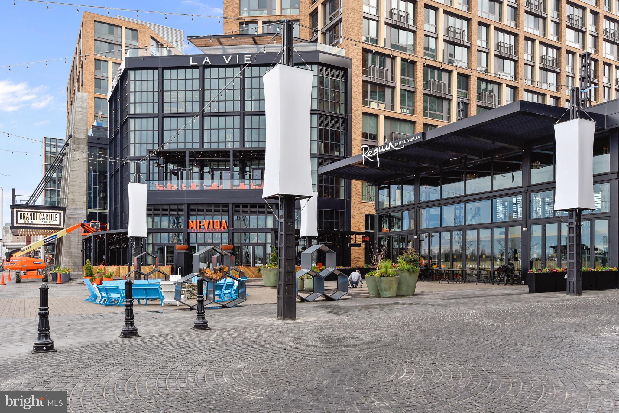 800 4th Street Southwest, Unit N103 Washington, DC 20024 - Photo 31 of 41 a city street lined with tall buildings and a large building