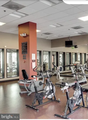 a terrace with outdoor seating and city view