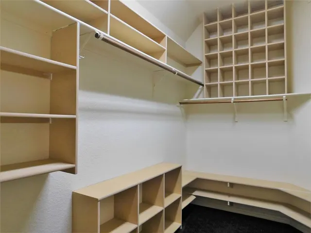 a view of an empty walk in closet