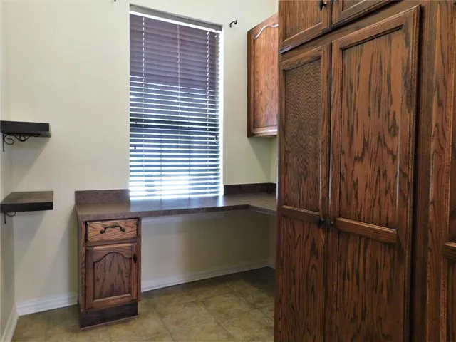 a view of a closet area with stairs