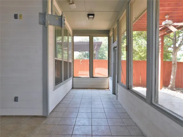 a view of a hallway with windows