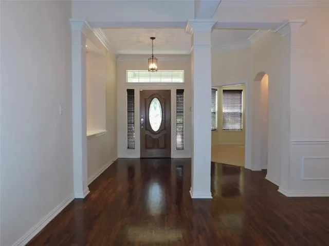 wooden floor in an empty room and a mirror