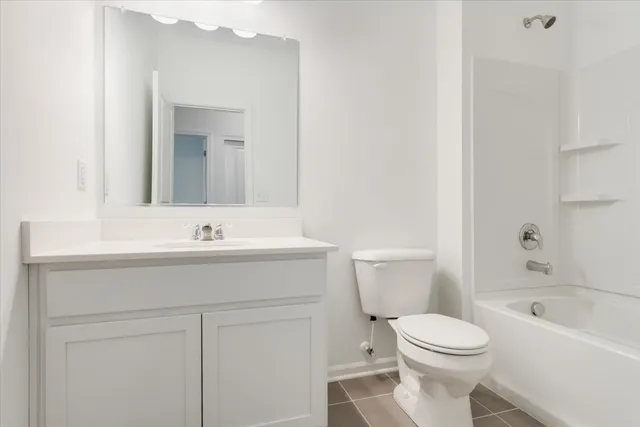 a view of a house with a yard and garage