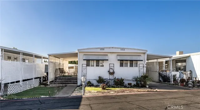 a front view of a house with yard