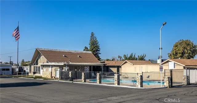 a large room with lots of furniture and a chandelier