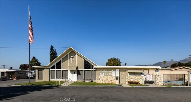 a view of a house with swimming pool and sitting area