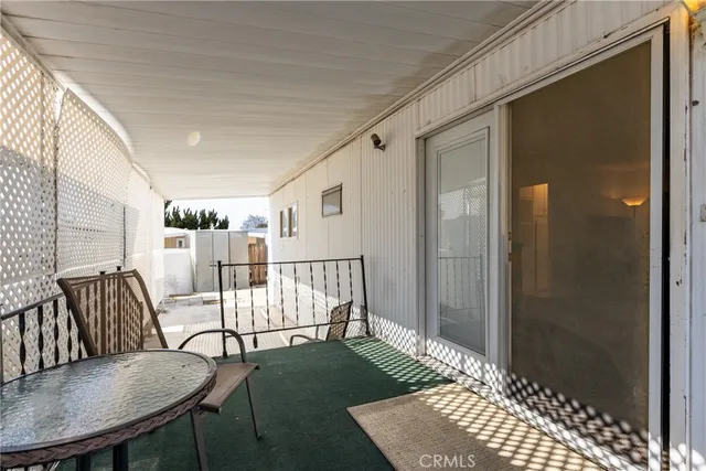 a view of a livingroom with furniture and a flat screen tv