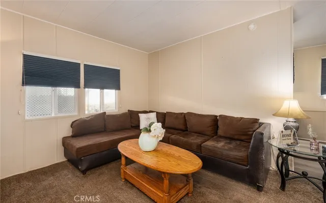a view of a dining room with furniture and window