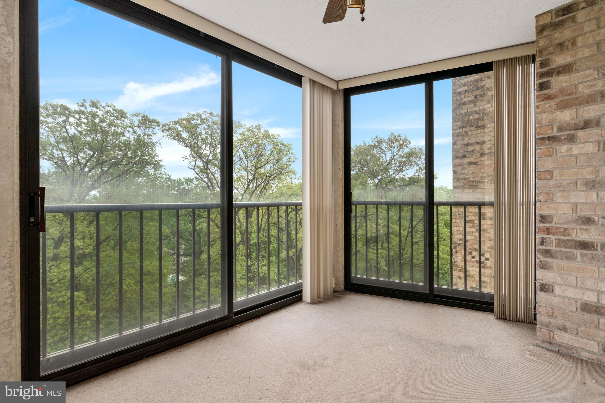 a view of a room with sliding windows