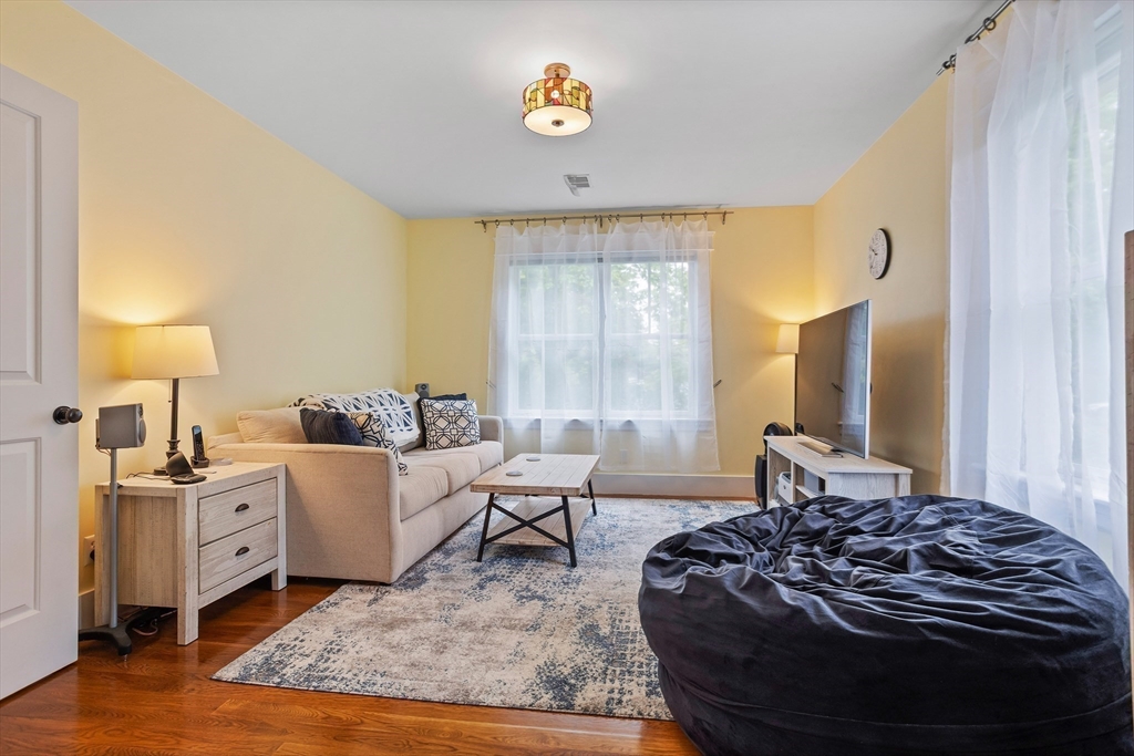 5 Walnut Street Lexington, MA 02421 - Photo 12 of 34 a living room with furniture and a rug