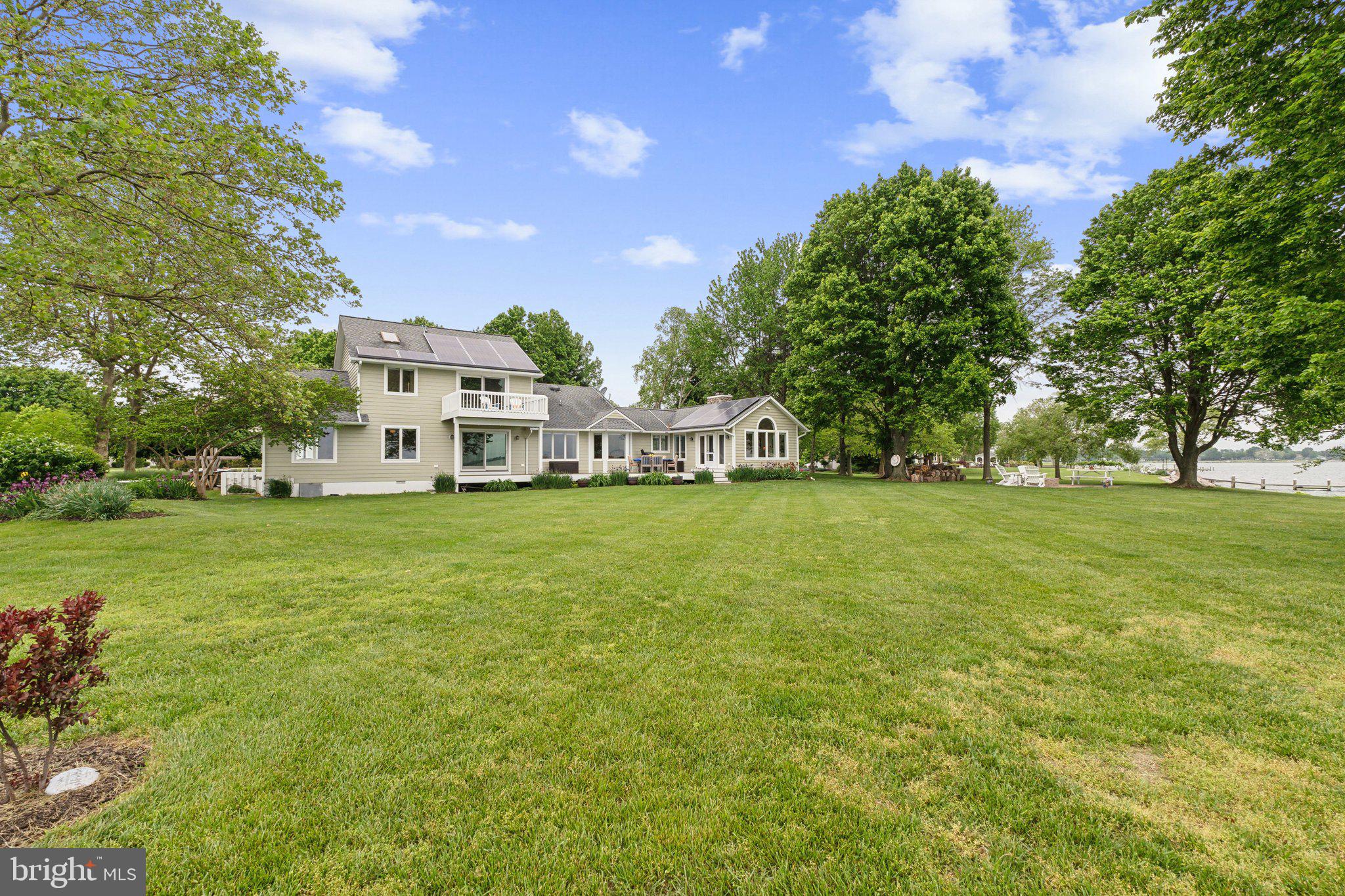 2921 Cox Neck Road East Chester, MD 21619 - Photo 15 of 66 a view of house with garden space and trees