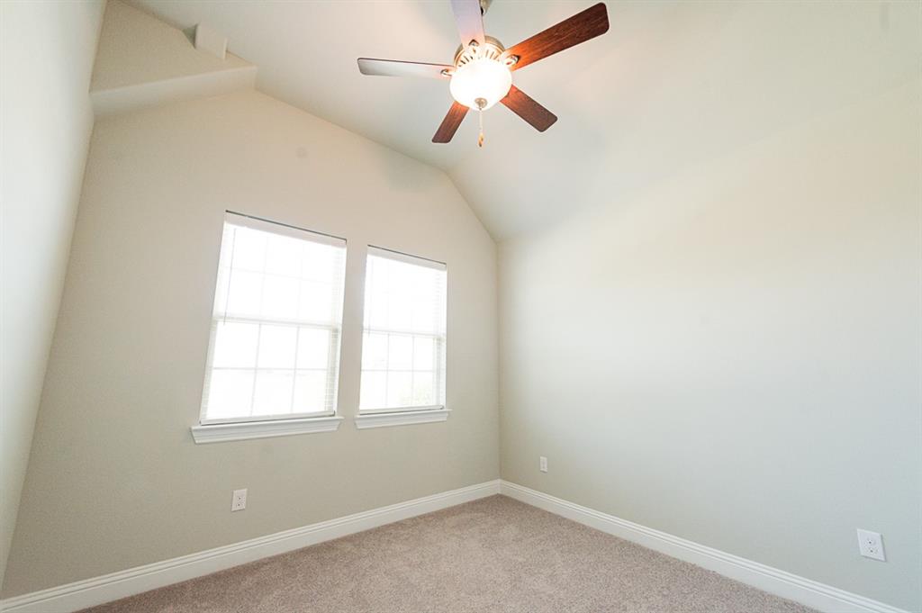 969 Canterbury Lane Forney, TX 75126 - Photo 15 of 24 an empty room with a window and a fan
