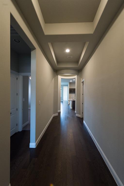 969 Canterbury Lane Forney, TX 75126 - Photo 18 of 24 a view of hallway with wooden floor