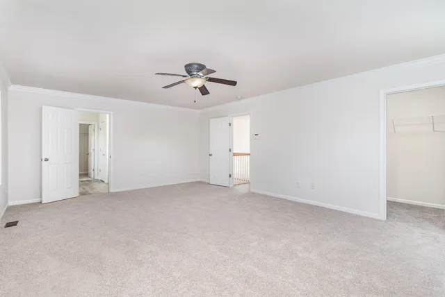 a view of an empty room with a bathroom