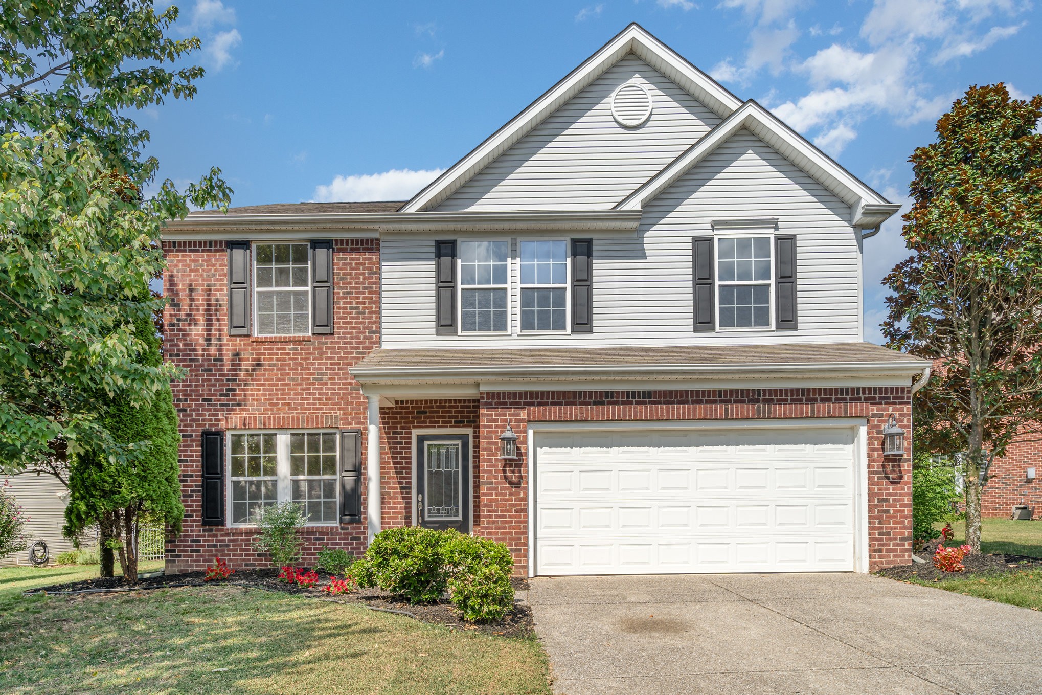 2005 Silverton Circle Spring Hill, TN 37174 - Photo 2 of 34 a front view of a house with a yard and garage