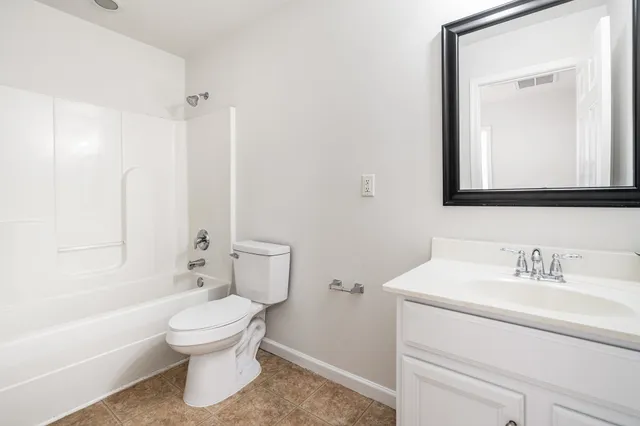 a bathroom with a toilet sink and a bathtub