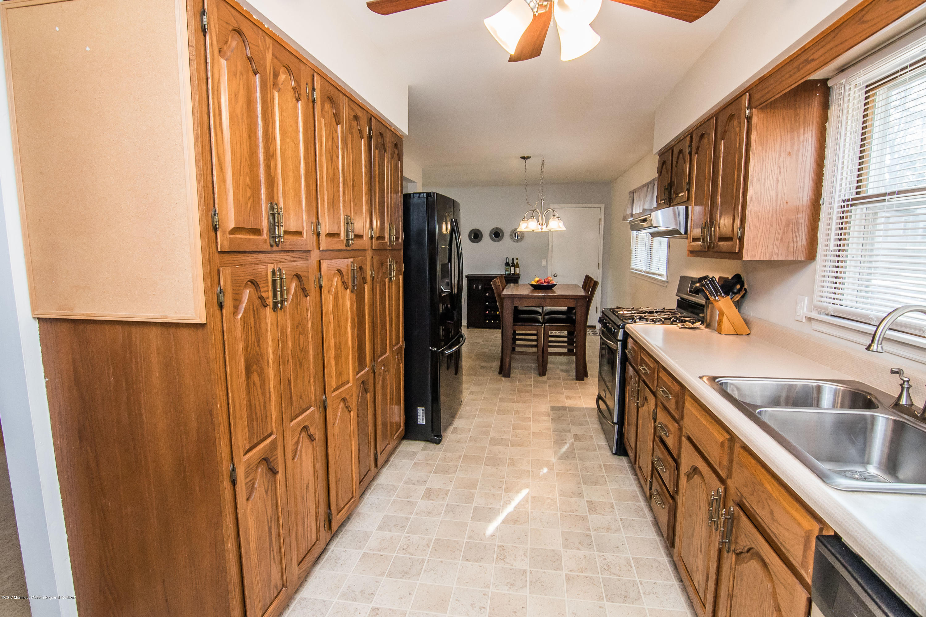 20 Hope Chapel Road Jackson, NJ 08527 - Photo 12 of 38 a kitchen with kitchen island granite countertop a sink stainless steel appliances wooden floor and cabinets