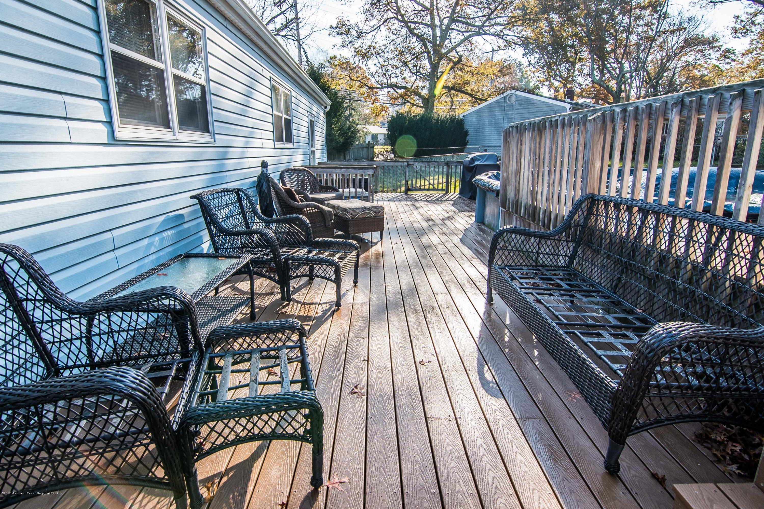 20 Hope Chapel Road Jackson, NJ 08527 - Photo 28 of 38 a view of a patio with wooden floor table and chairs