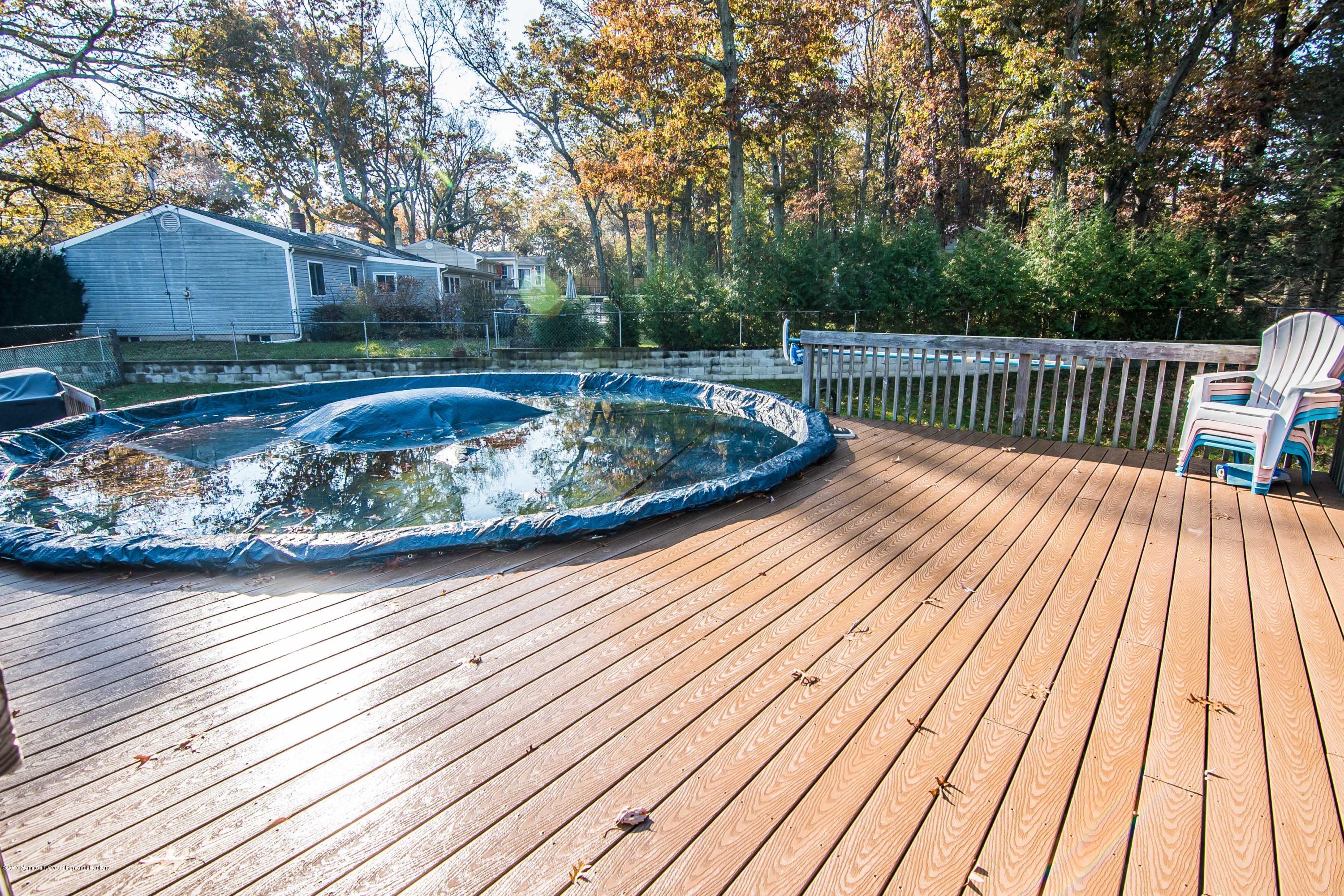 20 Hope Chapel Road Jackson, NJ 08527 - Photo 32 of 38 a balcony with wooden floor and outdoor seating