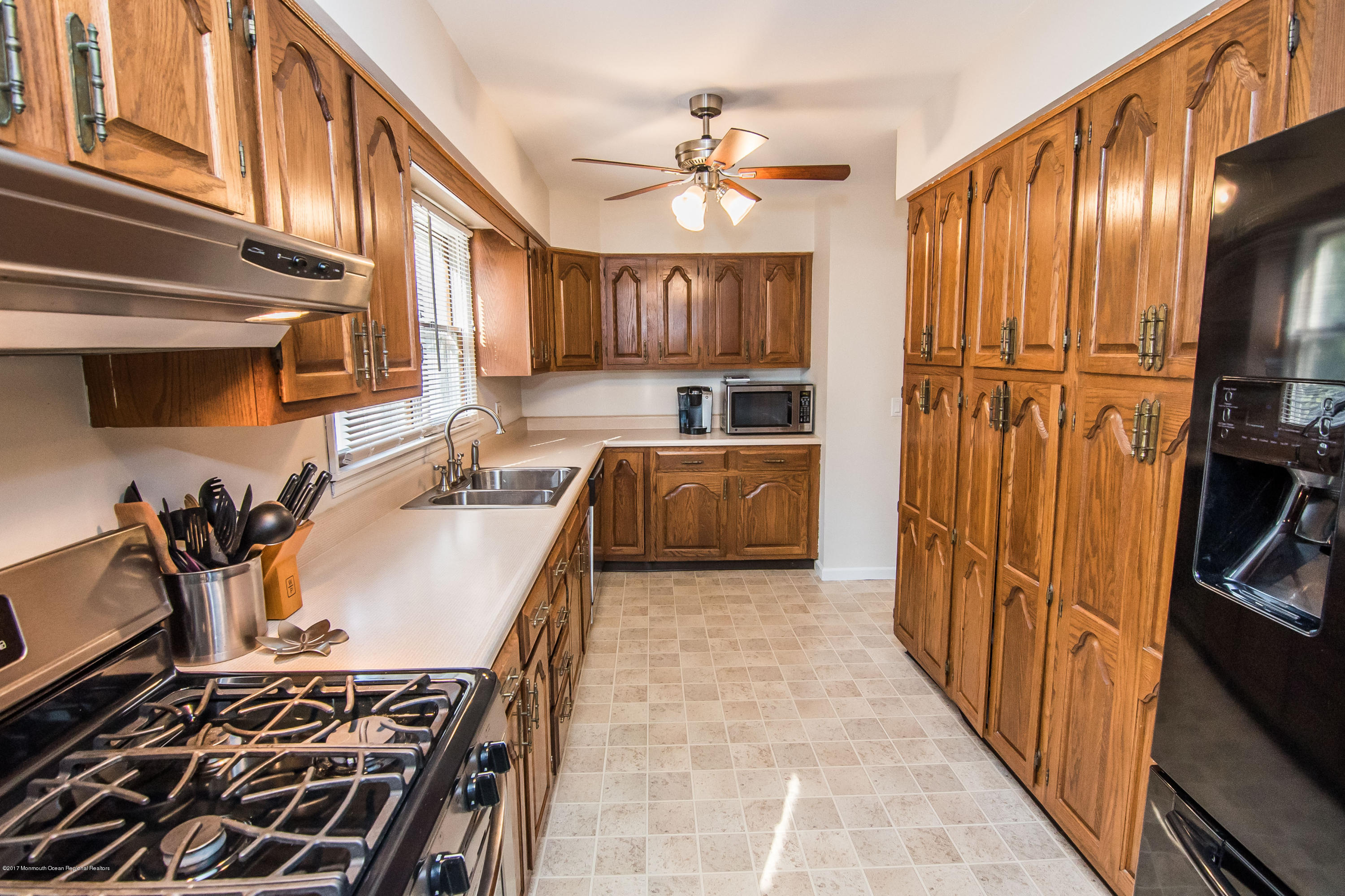 20 Hope Chapel Road Jackson, NJ 08527 - Photo 10 of 38 a kitchen with wooden cabinets and a stove