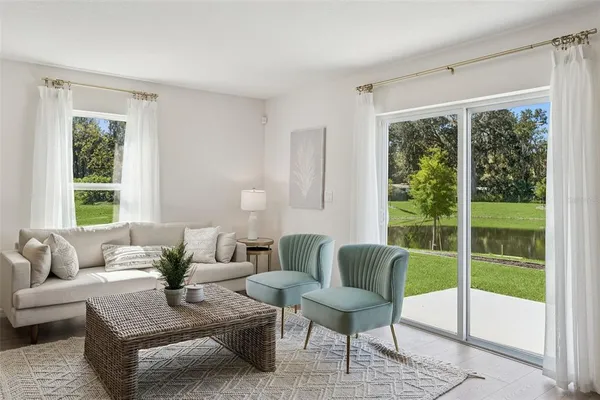 a living room with furniture and a window