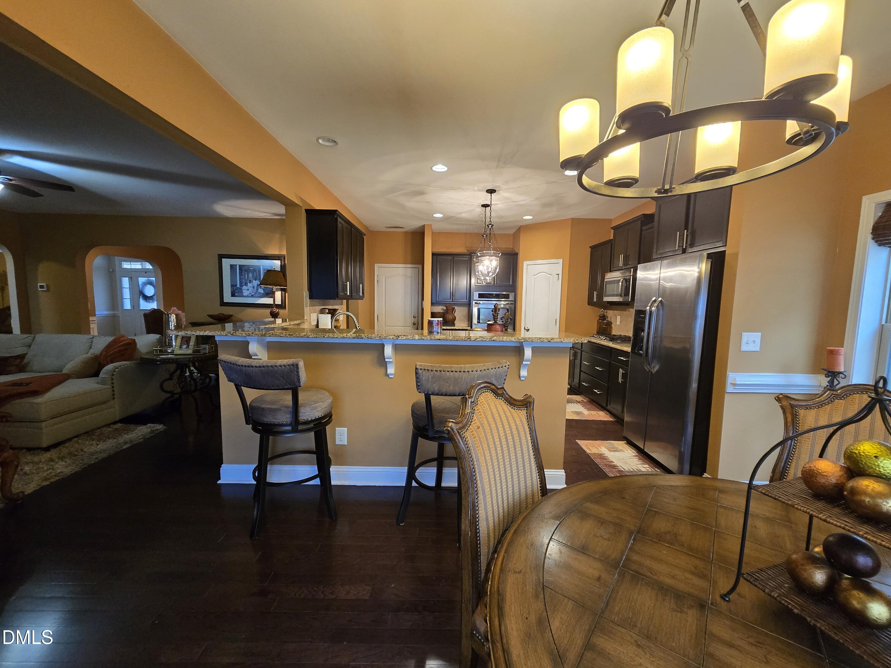 4202 Smithson Court Raleigh, NC 27616 - Photo 14 of 54 a view of a dining room with furniture