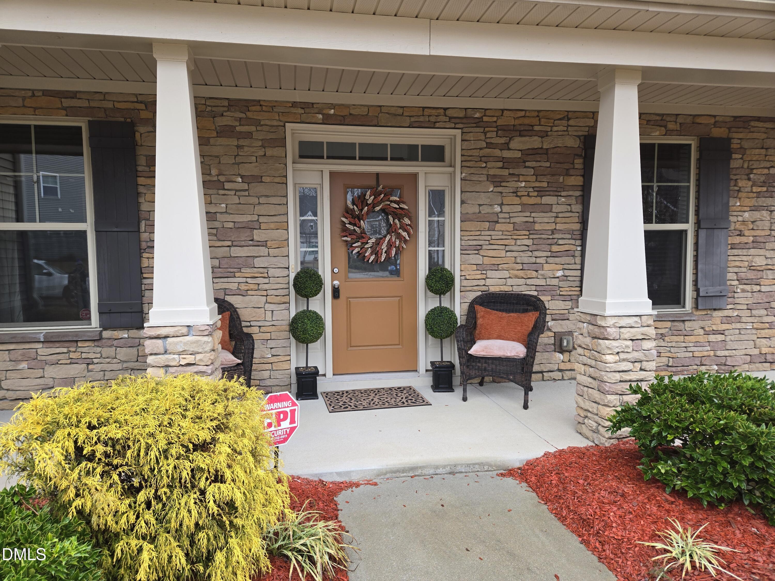 4202 Smithson Court Raleigh, NC 27616 - Photo 2 of 54 a front view of a house with outdoor seating