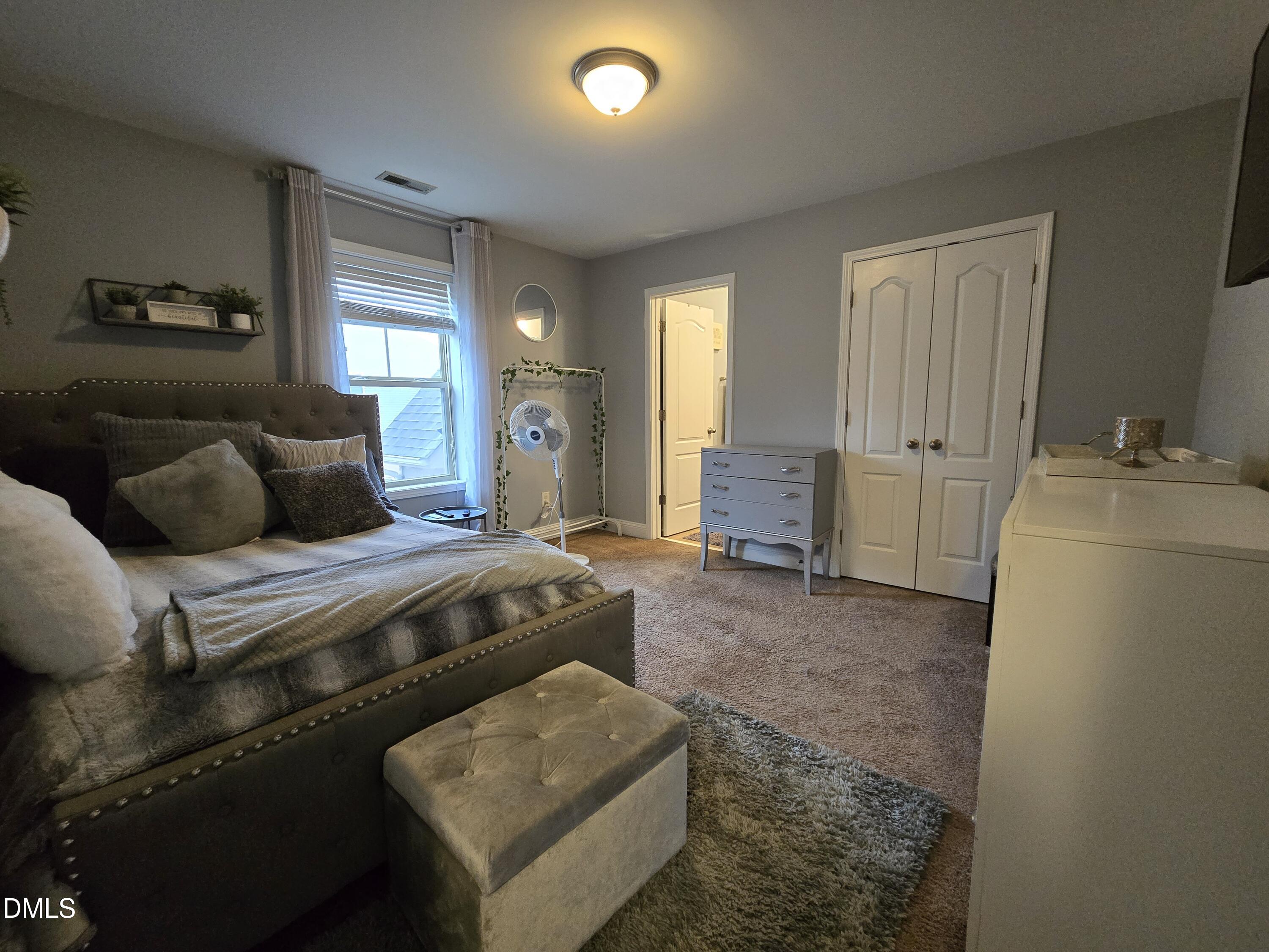 4202 Smithson Court Raleigh, NC 27616 - Photo 29 of 54 a bedroom with bed and window